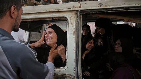 Palestinians mourn their relatives killed from an Israeli army bombardment of Gaza, at Shifa Hospital in Gaza City on Tuesday, July 22, 2025.