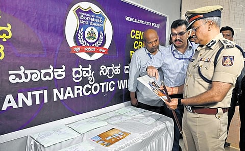 City Police Commissioner Seemnath Kumar Singh inspects drugs seized by the
Anti-Narcotics Wing in Bengaluru on Tuesday