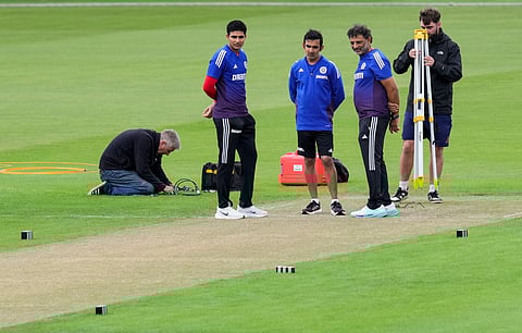 India head coach Gautam Gambhir, skipper Shubman Gill and batting coach Sitanshu Kotak inspecting the pitch at Old Trafford