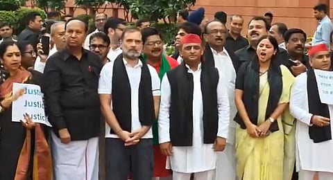 Opposition members protest on the parliament grounds ahead of the day 3 of the Monsoon session on Wednesday.