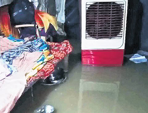Rainwater inundates a house in a low-lying area of Besthawada in Malluru village, Mulugu district, on Wednesday