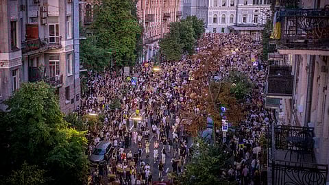 Thousands of people protest against a law targeting anti-corruption institutions near the President's Office in Kyiv, Ukraine, Wednesday, July 23, 2025.