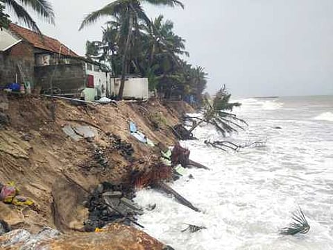 Increasing sea erosion damaging houses in Puthenthurai coastal village in Kanniyakumari district on Thursday.