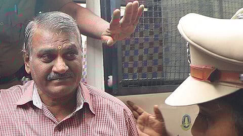 Ex-inspector Sridhar brought to court in Madurai.