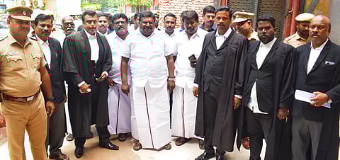 Tamil Nadu Transport Minister SS Sivasankar outside the Cuddalore court