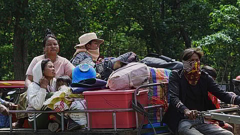 Cambodians sit on a tractor as they take refuge in Wat Tham Kambar in Oddar Meanchey province, Cambodia, Friday, July 25, 2025, as Thai and Cambodian soldiers have clashed along the border between their countries in a major escalation.