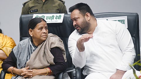 Tejashwi Yadav, RJD leader and LoP in the Bihar Assembly, interacts with his mother and former Bihar CM Rabri Devi at a party event in Patna.