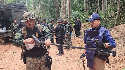 Thai soldiers inspect a border area on Sunday, July 20, 2025, in Ubon Ratchathani province, where the Royal Thai Army said two anti-personnel landmines were found.