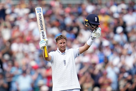 Joe Root celebrates his hundred at Old Trafford on Friday