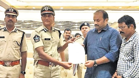Fire Services DG Pratap issues safety certificate to a mall owner.