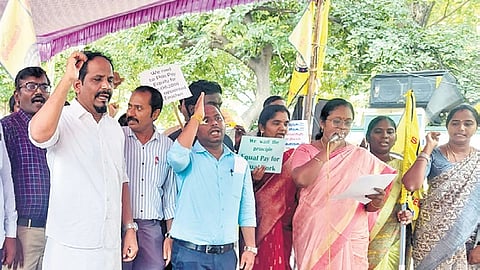Around 200 secondary grade teachers staged a hunger strike at Rajarathinam Stadium in Egmore, Chennai, on Saturday, demanding equal pay for equal work