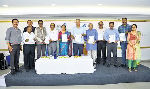 BBMP Chief Commissioner Maheshwar Rao (sixth from right) and B.PAC members release ‘IRR Street: Standstill to Active’ report in Bengaluru on Saturday.