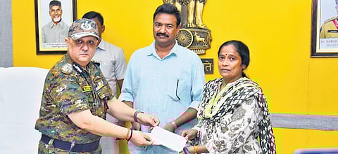 Director General of Police Harish Kumar Gupta hands over an immediate relief of Rs 20,000 each to the surrendered Maoist couple on Saturday.