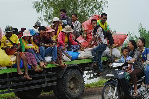 Cambodians sit on a cart of a tractor as they take refuge in Oddar Meanchey province, Cambodia, Saturday, July 26, 2025.