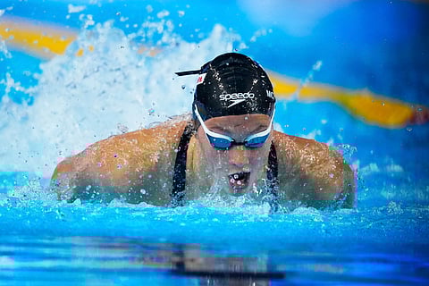 Summer Mcintosh of Canada competes in the women's 200-meter individual medley heat at the World Aquatics Championships in Singapore, Sunday, July 27, 2025.