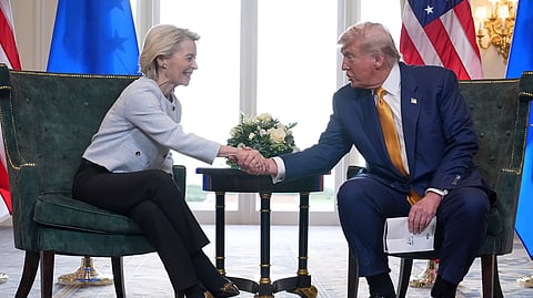 President Donald Trump and European Commission President Ursula von der Leyen shake hands after reaching a trade deal at the Trump Turnberry golf course in Turnberry, Scotland Sunday, July 27, 2025.