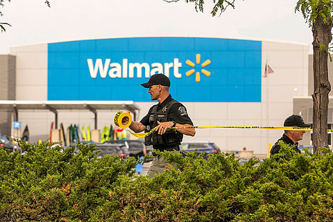 Grand Traverse Sheriff's deputies tape off the parking lot of a Walmart after a stabbing incident in Traverse City, Mich., Saturday July 26, 2025.