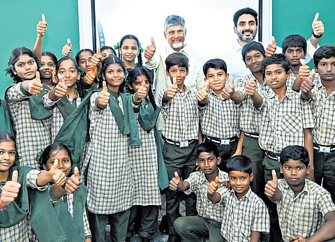 Chief Minister Chandrababu Naidu and Minister Nara Lokesh with school students