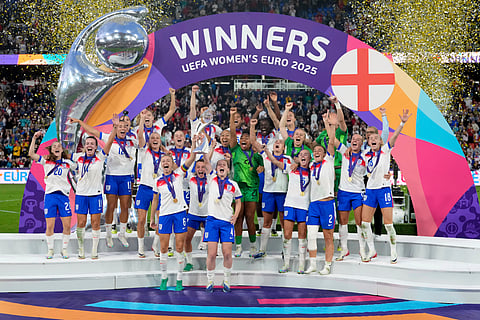 England's Leah Williamson, center left, and Keira Walsh lift the trophy after winning the Women's Euro 2025 final soccer match between England and Spain at St. Jakob-Park in Basel, Switzerland, Sunday, July 27, 2025.