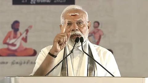 As his convoy passed, Modi waved to the cheering crowds lined up on both sides of the road.