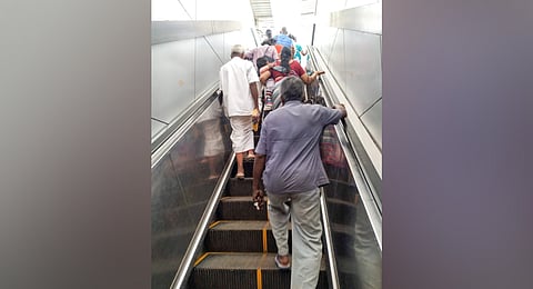 Elderly persons, women with children struggling to climb the steps due to non functioning escalators at Tiruchy Railway junction