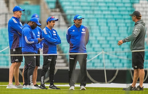 Indian team support staff taking to groundstaff at the Oval