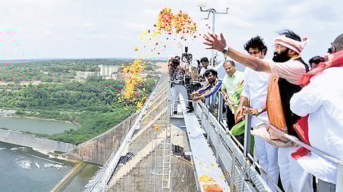 Irrigation Minister N Uttam Kumar Reddy performs a special puja as he releases water from Nagarjunasagar dam on Tuesday