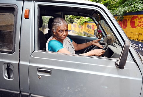 Rama Kumari driving her van