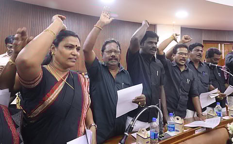AIADMK and BJP councillors staging a protest wearing black dress demanding mayor Indirani Ponvasanth’s resignation over the property tax scam.