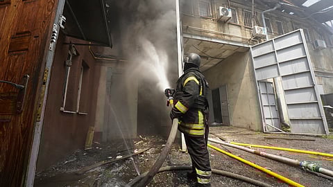 Firefighters tackle the blaze after Russian attack that hit a residential area in Kharkiv, Ukraine,