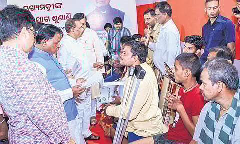 CM Mohan Charan Majhi meeting people at his grievance cell on Monday.