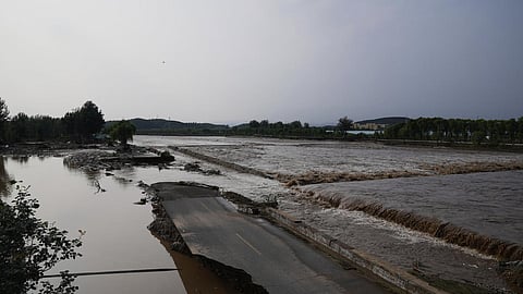 A damage road is seen at a flooded area after heavy rains in Miyun district on the outskirts of Beijing, China, on July 28, 2025.
