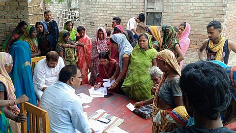 BLOs fill and collect the counting forms from the electors in Patepur block of Vaishali.