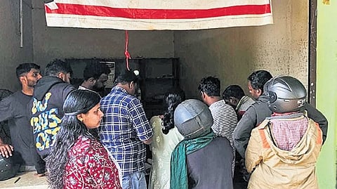 Visitors waiting in front of the revenue outpost to collect entry pass