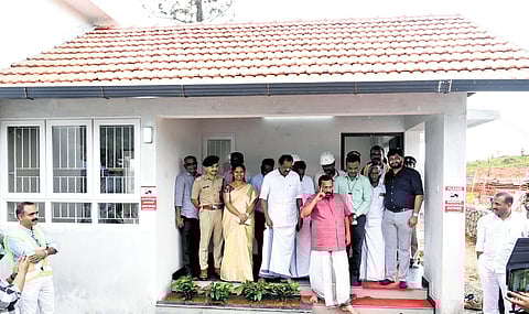 Ministers K Rajan and O R Kelu and Wayanad District Collector D R Meghashree at the model house built at the landslide rehabilitation township at Kalpetta