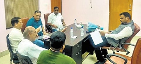 Swain in talks with the OIA officials at Jagatpur IDCO office.