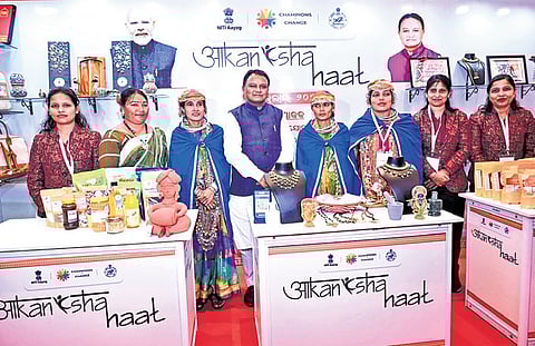 Majhi along with tribal women from aspirational blocks at the launch of Akanksha Haat, in Bhubaneswar on Tuesday.