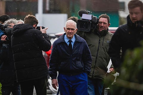 Gloriavale's overseeing shepherd Howard Temple, center, arrives at the Greymouth District Court in Greymouth, New Zealand, on Aug. 2, 2023.