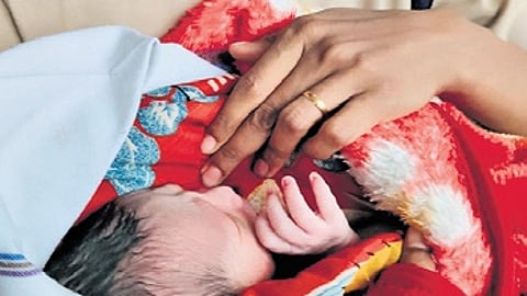 An RPF personnel keeps the newborn warm at Sir M Visvesvaraya Terminal
on Thursday