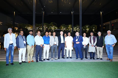 Minister NS Boseraju flanked by Prof Duncan Haldane and Prof David Gross in Bengaluru on Wednesday.