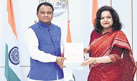 CM Mohan Majhi receiving inquiry report on Puri stampede from development commissioner Anu Garg on Thursday