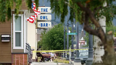 Police tape surrounds The Owl Bar in of Anaconda, Mont., on Friday, Aug. 1, 2025, following a fatal shooting.