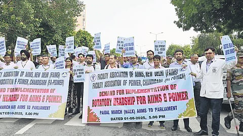 Faculty members of AIIMS hold a protest march to Parliament demanding implementation of rotatory headship, Friday, August 1, 2025.