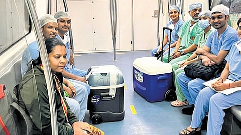Medical staff transport the donated liver in a Metro train in Bengaluru on Friday