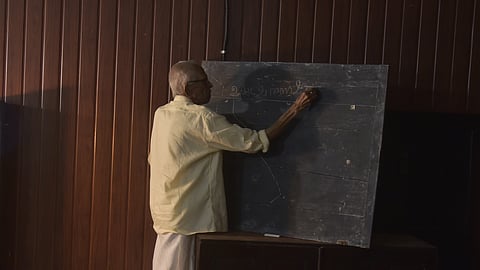 M K Sanoo giving a ‘lesson’ to the alumni of Maharaja’s College as part of the ‘Back to Classes’