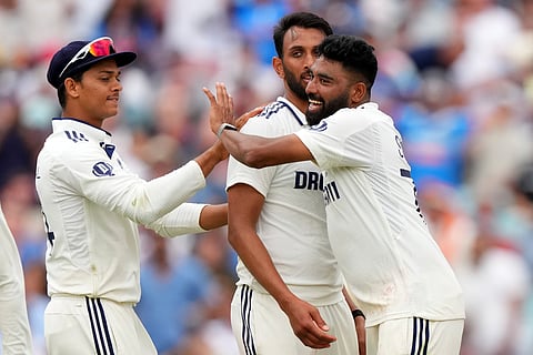 India pacers Siraj and Krishna celebrating the wicket of Joe Root.