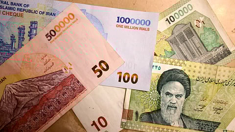This picture shows new Iranian bank notes of one million, 500,000, and 100,000 rials on August 3, 2025. The economic commission of Iran's parliament revived long-delayed plans on August 3 to cut four zeros from the counrty's plunging currency, as part of efforts to simplify financial transactions