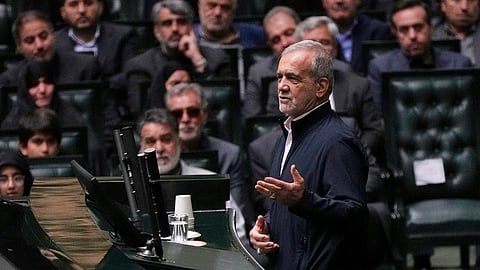 Iranian President Masoud Pezeshkian speaks during a memorial at the parliament in Tehran, Iran, Wednesday, May 21, 2025.