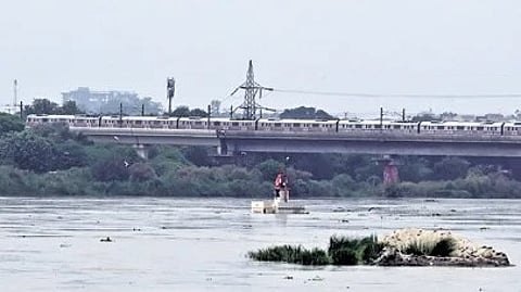 Yamuna water level nears danger mark at Old Railway Bridge on Sunday.