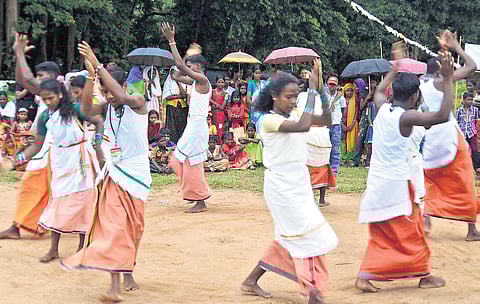Residents of the Nedumkayam tribal colony near Karulai in Nilambur performing traditional tribal dance as part of the Onam celebrations held in the colony.